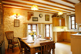 Large kitchen, with windows on three sides giving sunshine all day